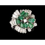 A ring500/000 platinum, set with 8 pear cut emeralds (ca.1.50ct), trapeze cut diamonds (ca.1.20ct)