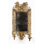 A two branch mirror / wall sconceIn gilt metalMoulded decoration of mythological figures,