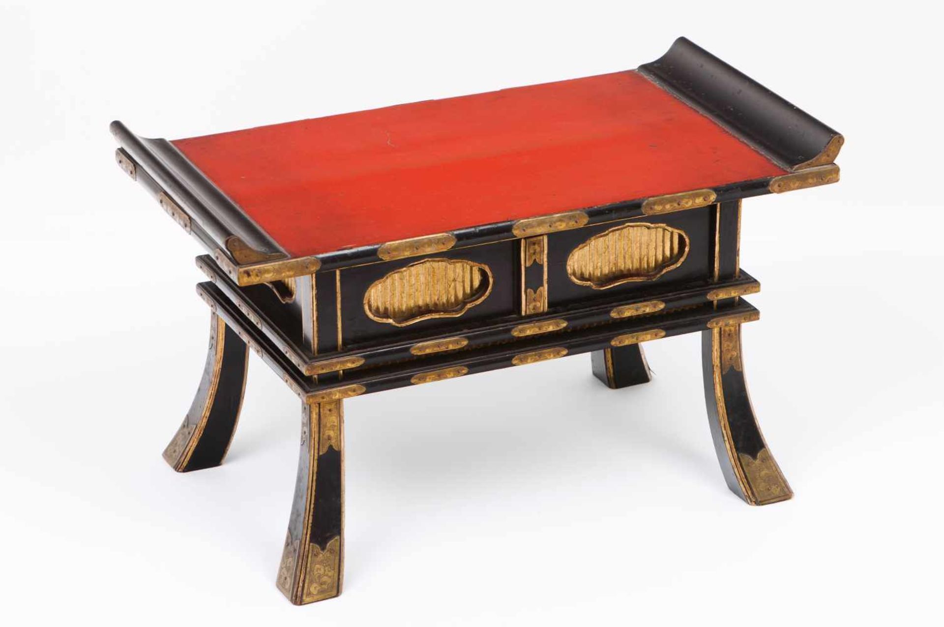 A miniature tableBlack and red lacquered woodGilt decoration with metal applied detailsOne