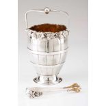 An ice pail and tongSilverHalf barrel shaped body with wine related motifs frieze. Tong with