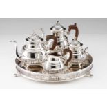 A tea and coffee set with trayPortuguese silver. Fluted decoration on 4 ball feet. Wooden