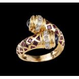 A ringSet in gold with two sapphire cabochons, square cut rubies and 12 small brilliant