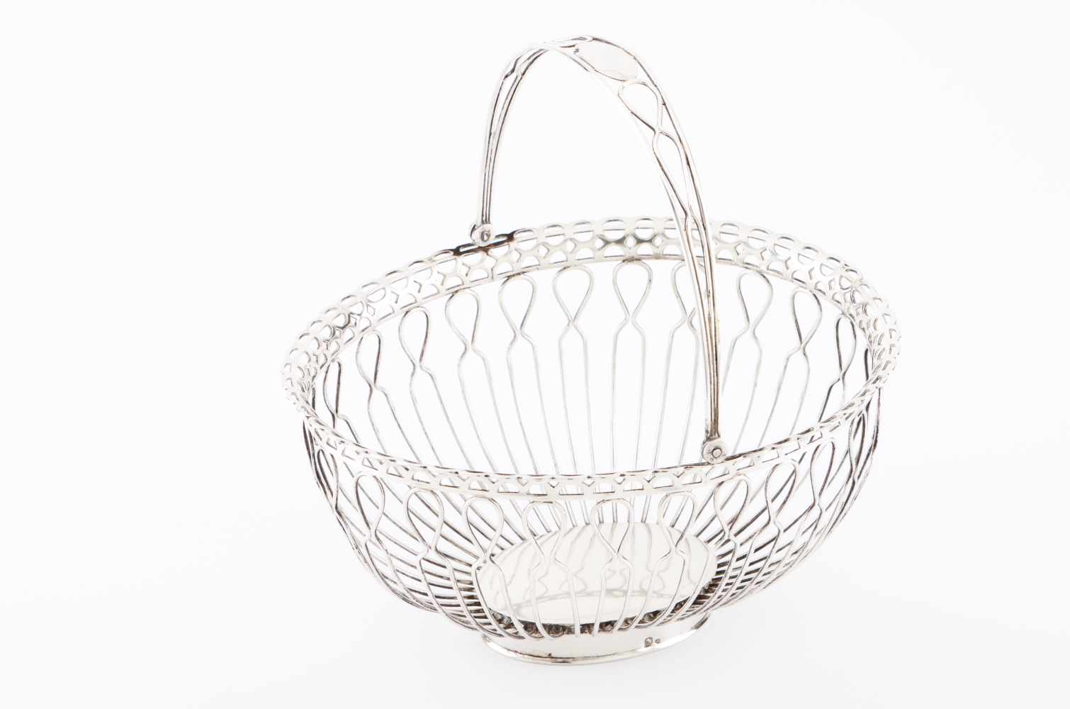 A bread basket with handlePortuguese silverA silver thread body with galleryOporto "boar II" assay