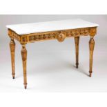 A Louis XVI credence tableCarved and gilt wood decorated with floral motifsFluted, baluster shaped