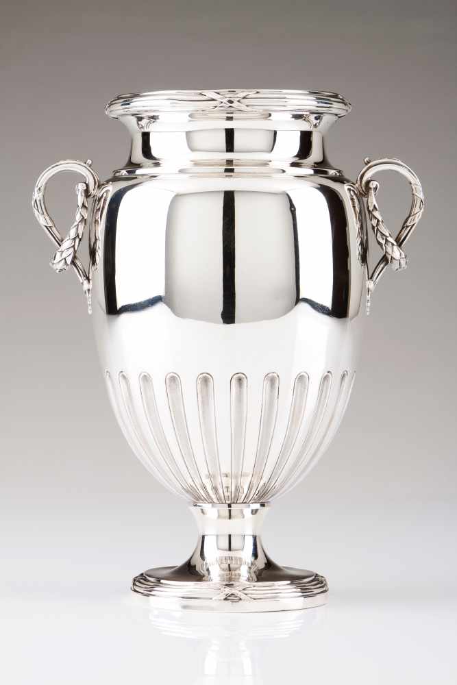 A vaseFrench silverPart fluted, urn shaped body with foliage and garland decorated volute