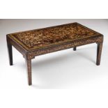 A centre tableLacquered wood with plant and bird japanned decoration on the top41x101x58 cm