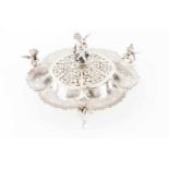 A table centerpiecePortuguese chiselled and pierced silver with foliage scroll decoration, supported