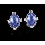A pair of earringsSet in 14kt white gold with two oval tanzanite cabochons and eight baguette cut
