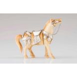 A Luiz Ferreira horseIvory sculpture with chiselled silver harness and details and ruby eyesOporto