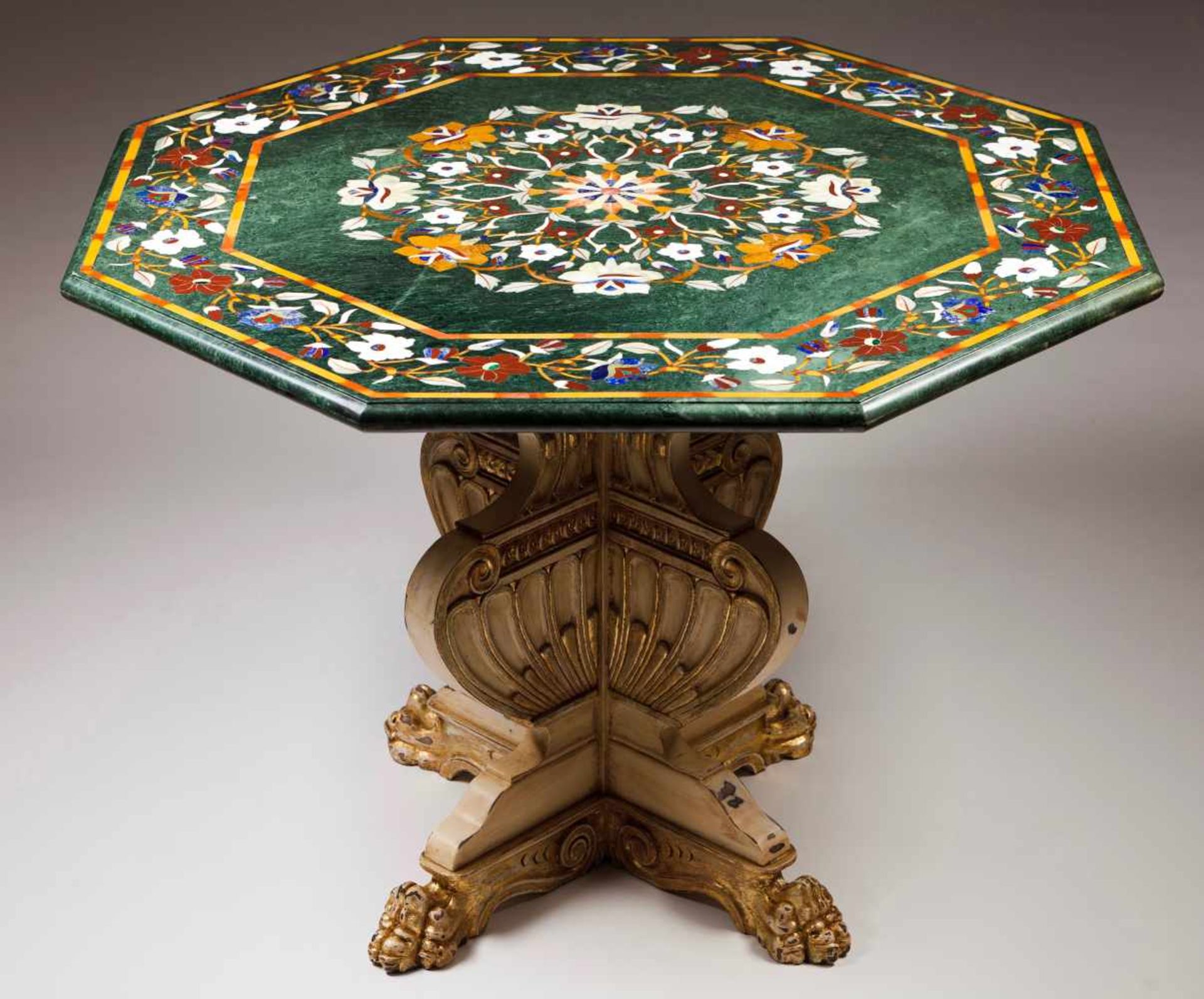 A centre tableOctagonal marble top with floral and foliage scroll "Pietra Dura" inlaysPainted and
