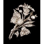 A branch with flower broochSilver and gold entirely set with vintage round cut diamonds (ca.0.80ct)1