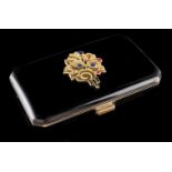 An Art Deco vanity caseBlack enamelled silvergilt with gold application at the cover with stylized