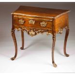 A D.José side tableWalnutCarved apron and gilt friezesOne drawer and chiselled and gilt bronze