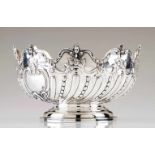 A large bowl19th c. English silverRepousse and chiselled decoration with foliage scrolls and