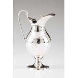 A D.Maria milk jugPortuguese silver. Chiselled body with foliage scrolls, garlands and