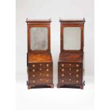 A pair of George III bureau bookcasesThe top with pierced and carved details and mirrored doors,