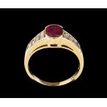 A ring18kt gold set with ten baguette cut diamonds (ca. 0,40ct) and one oval cut ruby (approx. 7,