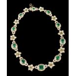 Necklace18kt gold set with 10 small round emeralds, 10 oval cut emeralds (largest measuring