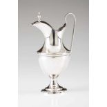 A neoclassical milk jugPortuguese silver. Plain body with band decoration and urn shaped lid