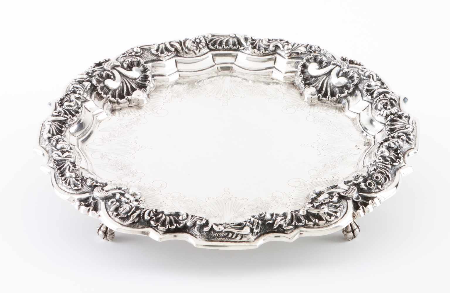 A salver, GUIAPortuguese silverTab decorated in relief and chiselled in the baroque manner with