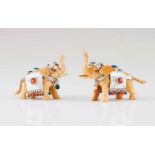 A pair of Luiz Ferreira elephantsBone sculpture with silver, coral and hardstone decorationOporto