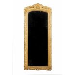 A Regence mirrorCarved and gilt woodDecorated with floral and shell motifsFrance, 18th century187x77