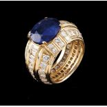 A ring585/000 gold set with a, possibly, Ceylon sapphire (ca.3.80ct), body decorated with friezes