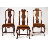 A D.José three chair setWalnutScalloped and foliage scroll carved splats and crestsCarved aprons and