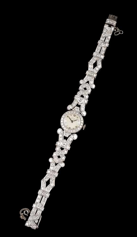 A Belle Époque watchGirard Perregaux in platinum, fully set with round brilliant cut diamonds (ca.