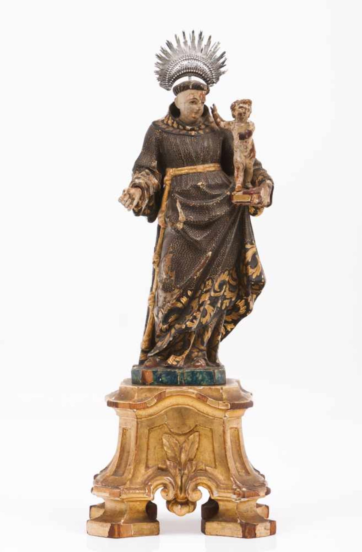 Saint Anthony and Baby JesusCarved, polychrome and gilt wooden sculptureSilver radiant haloCarved