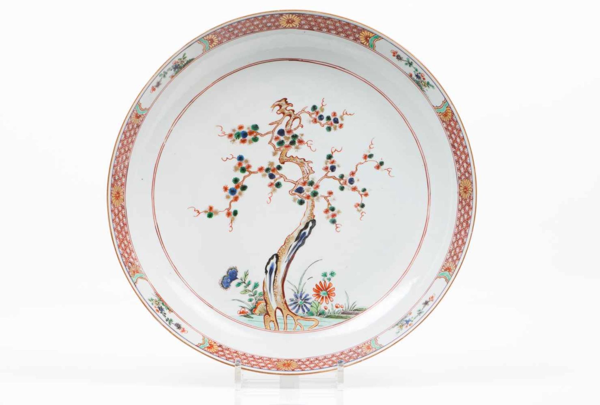 A large plateChinese export porcelainPolychrome, gilt and iron oxide "Famille Verte" enamels