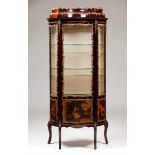 A Louis XV style display cabinetMahogany veneeredBeige silk lined interior with shelvesGlazed