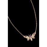 A necklace18kt gold, centre designed as a butterfly set with five rubies and 35 single cut