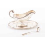 A sauceboat with tray and spoonPlain silver with guilloche frieze and volute handleLisbon 833/000 "