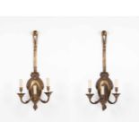 A pair of Louis XVI style three-light wall lightsBronzeMolded decorationEurope, 19th