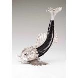 A Manuel Alcino dolphinStylised bone sculpted figure with raised silver applied details and onyx