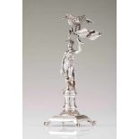 A toothpick holderPortuguese silver; American Indian figure holding a macaw on a trunkUnidentified