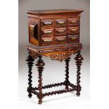 A cabinet on standRosewood and other timbersCarved and rippled decorationPierced and scalloped