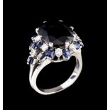 A ringPlatinum, set with 1 sapphire (16x12mm), 14 calibrated sapphires and 10 brilliant round cut