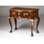 A D.João V / D.José style side tableWalnutPartially carved and gilt decorationTwo drawers and