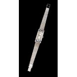 A wrist watchPlatinum Art Deco watch, set with vintage round brilliant cut diamonds and calibrated