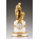 A Louis XVI style clockGilt bronze mounts on a white marble standOn the top a Venus and Cupid gilt
