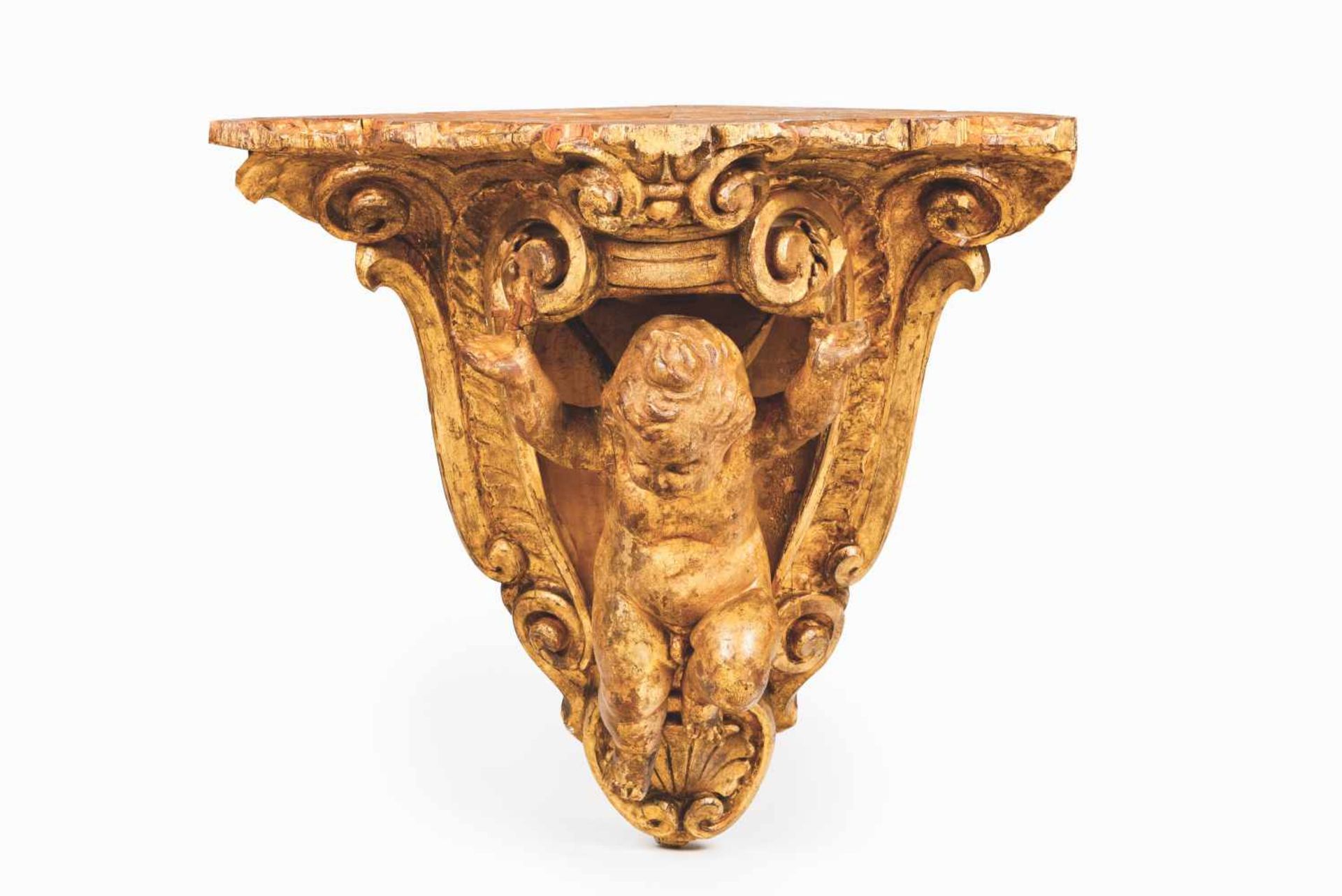 A large corner bracketCarved and gilt woodPutto and shell motifs decorationPortugal, 18th century(