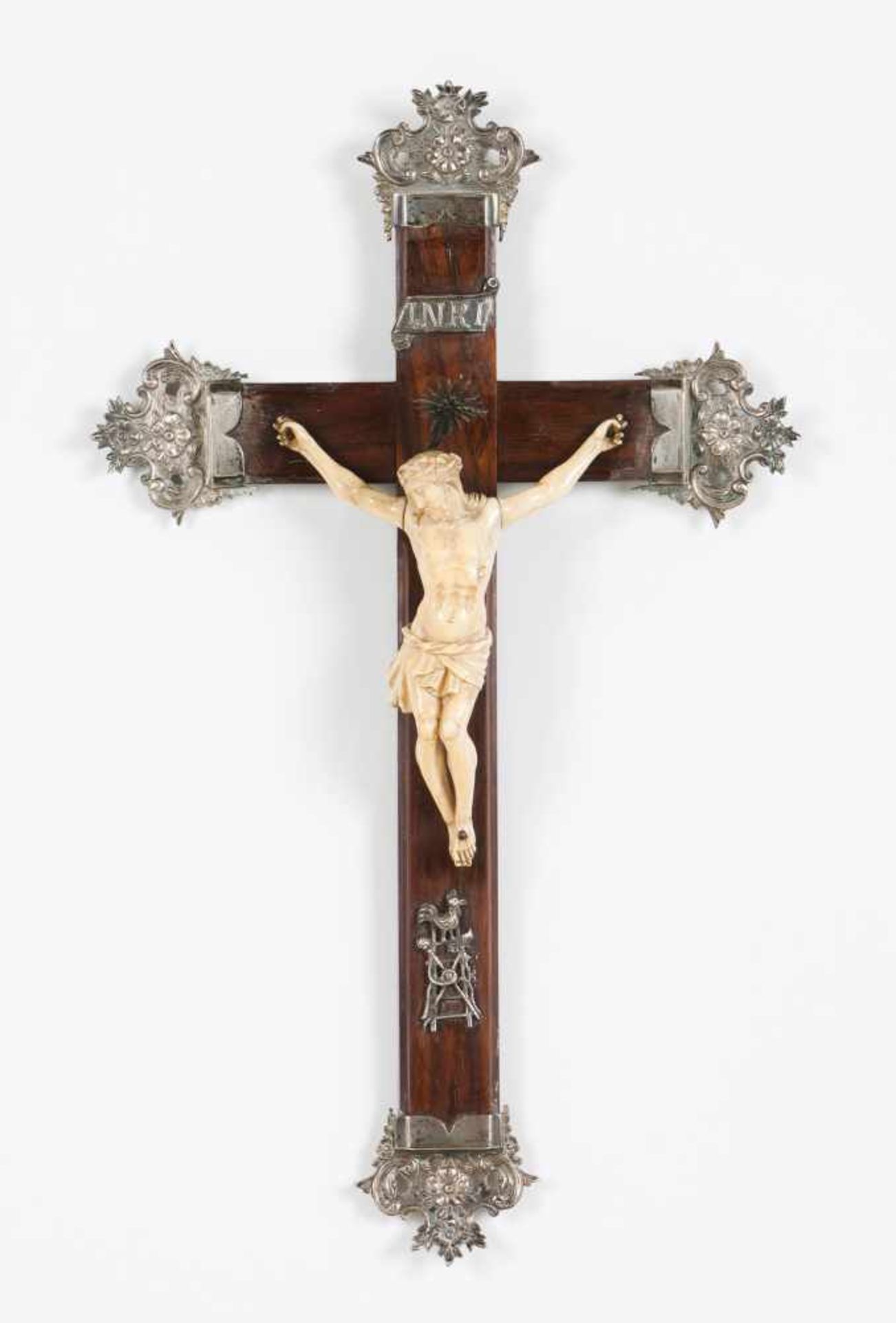 A crucified ChristIvory sculptureRosewood cross with applied silver elementsPortugal, 19th century(