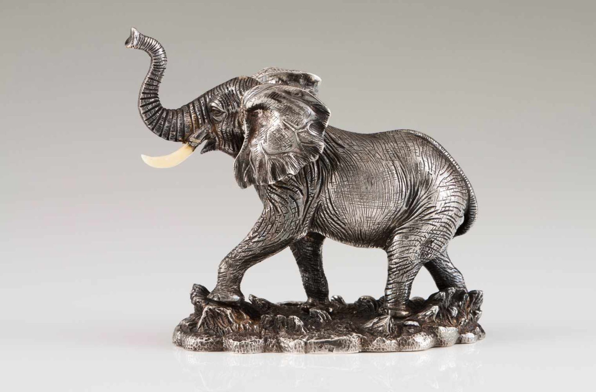 An elephantPortuguese silverRaised trunk elephant sculpture with bone tusksOporto hallmark, Eagle (