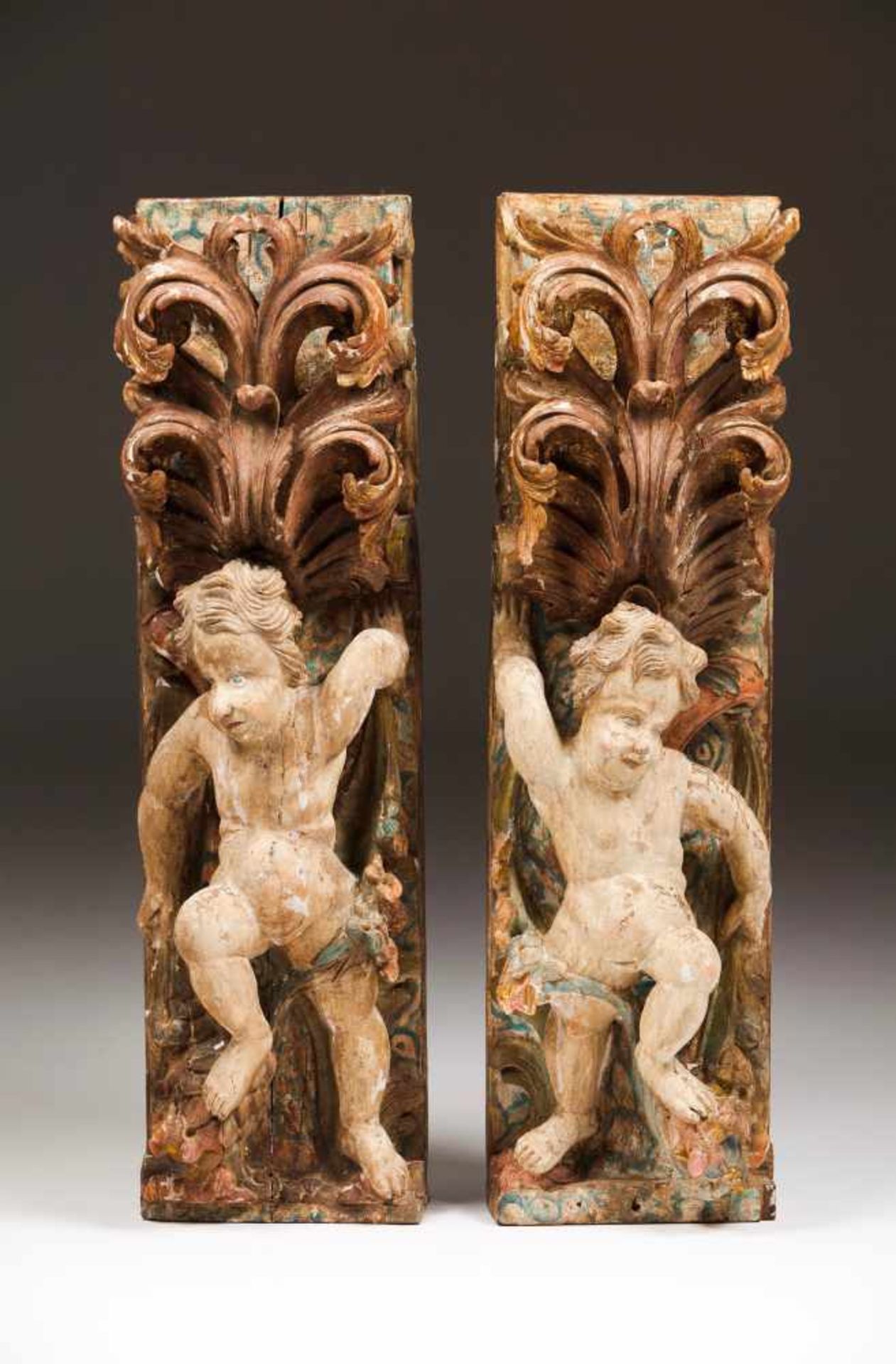 A pair of altar elementsCarved, gilt and polychrome woodDecorated with putti, acanthus leaves and