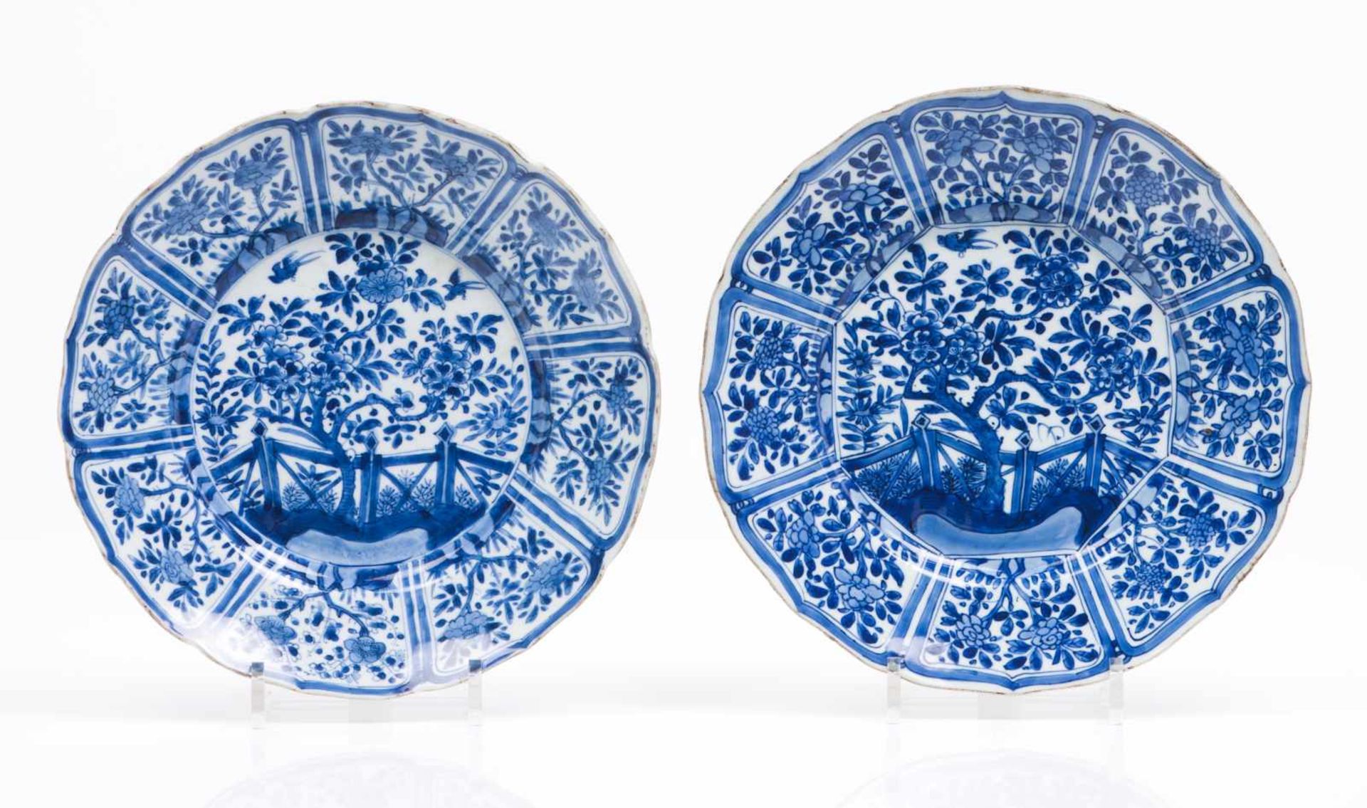 A pair of scalloped platesChinese export porcelainBlue underglaze decoration of garden with