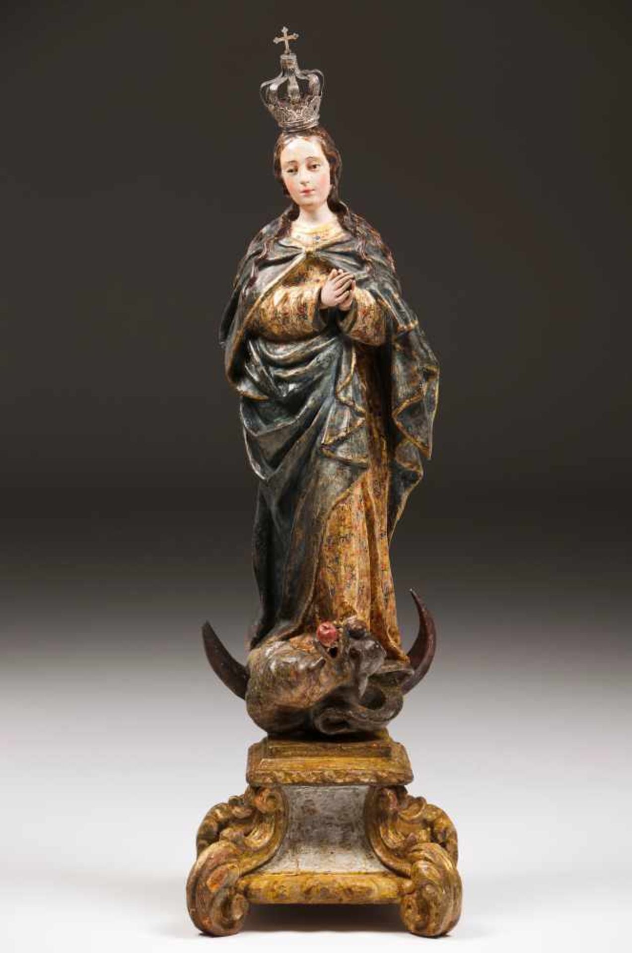 Our Lady of the Immaculate ConceptionCarved, polychrome and gilt woodCarved and gilt standSilver