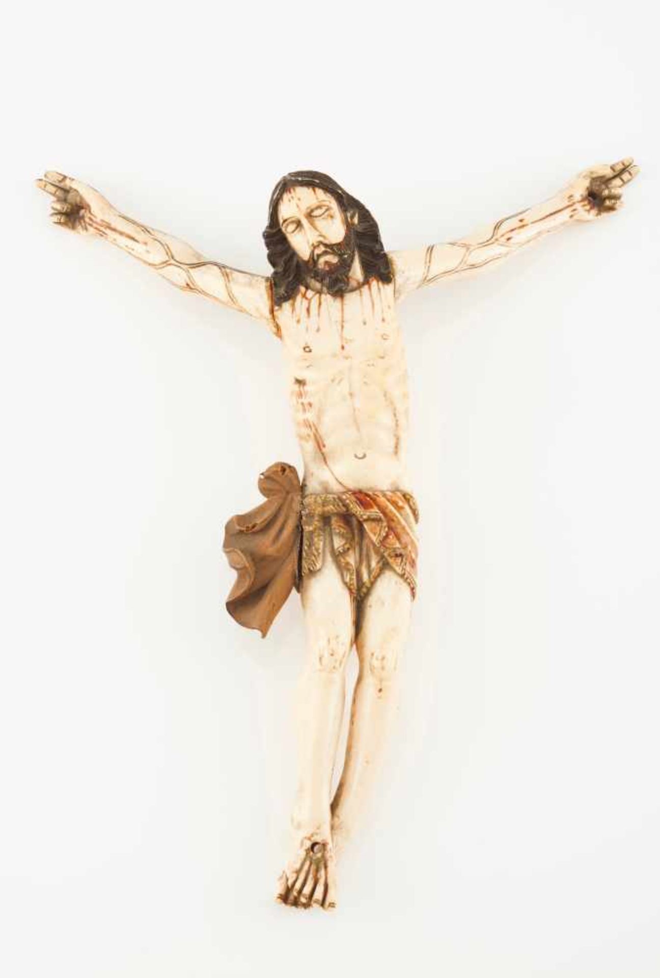 A Crucified ChristIvory Indo-Portuguese sculpturePartially polychrome and giltWooden lention