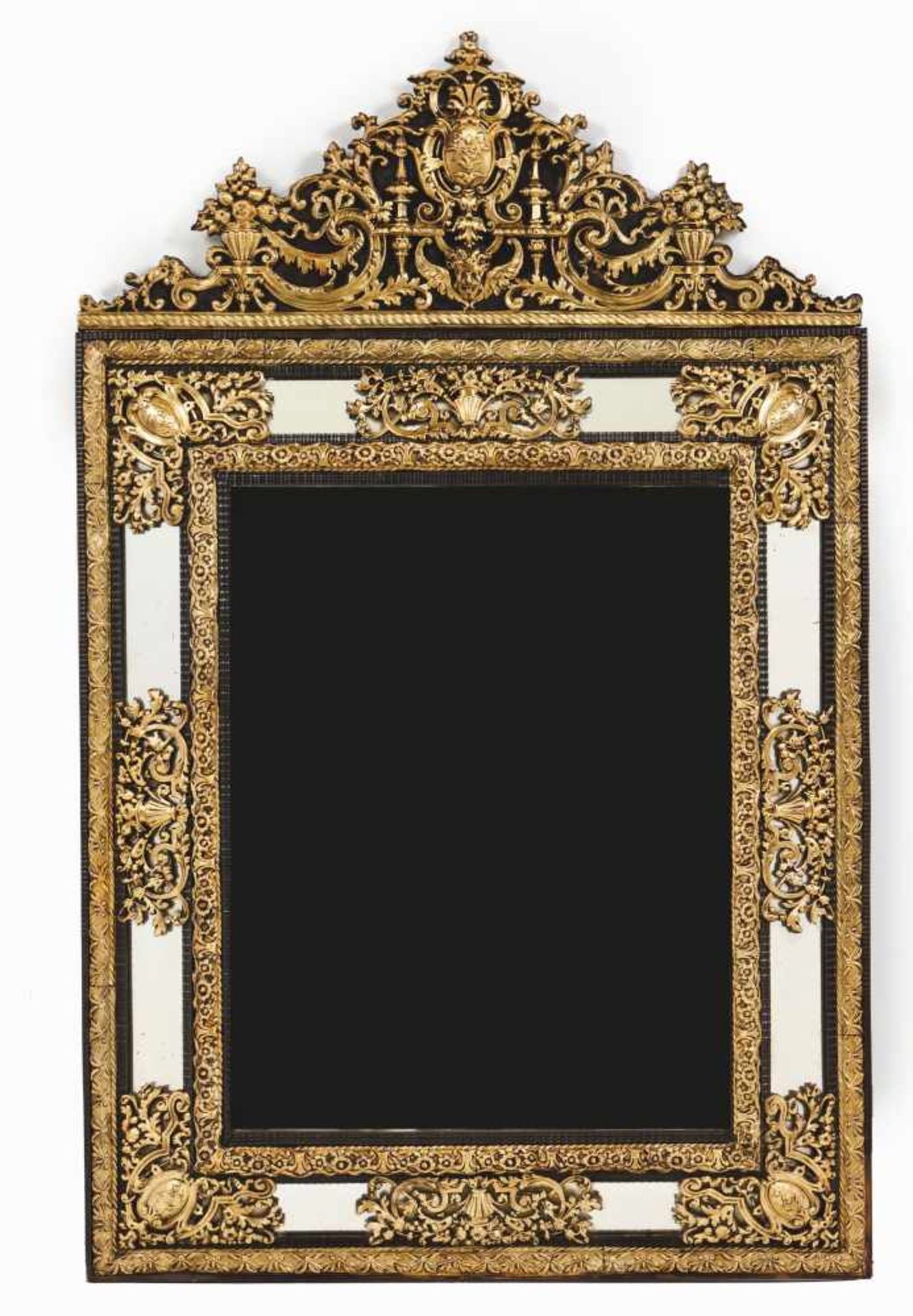 A large wall mirror Wooden frame Gilt metal raised foliage scroll decoration Scalloped crest Europe,